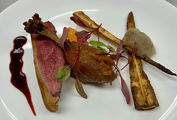 Lunch entree - seared duck breast with a duck leg confi.